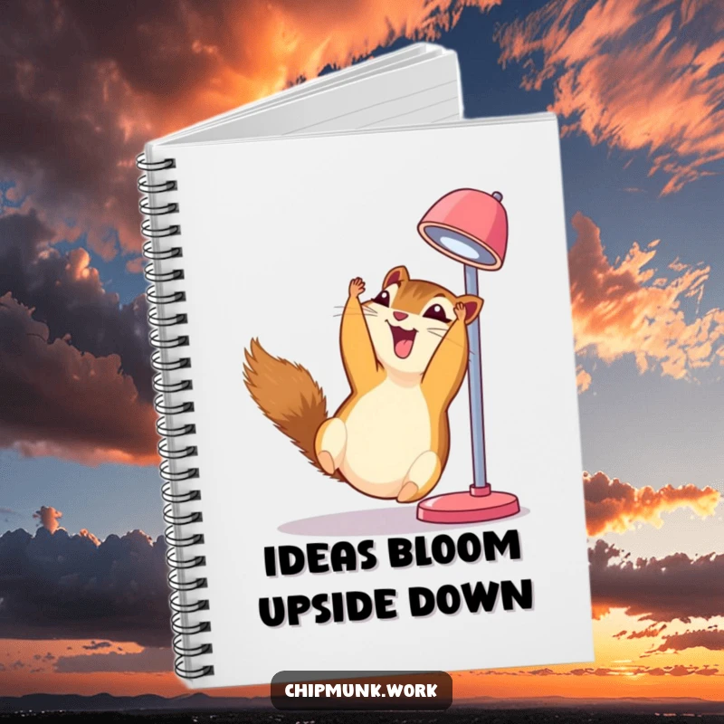 Funny chipmunk notebook, upside down from a desk lamp, giggling with delight, ready for notes.